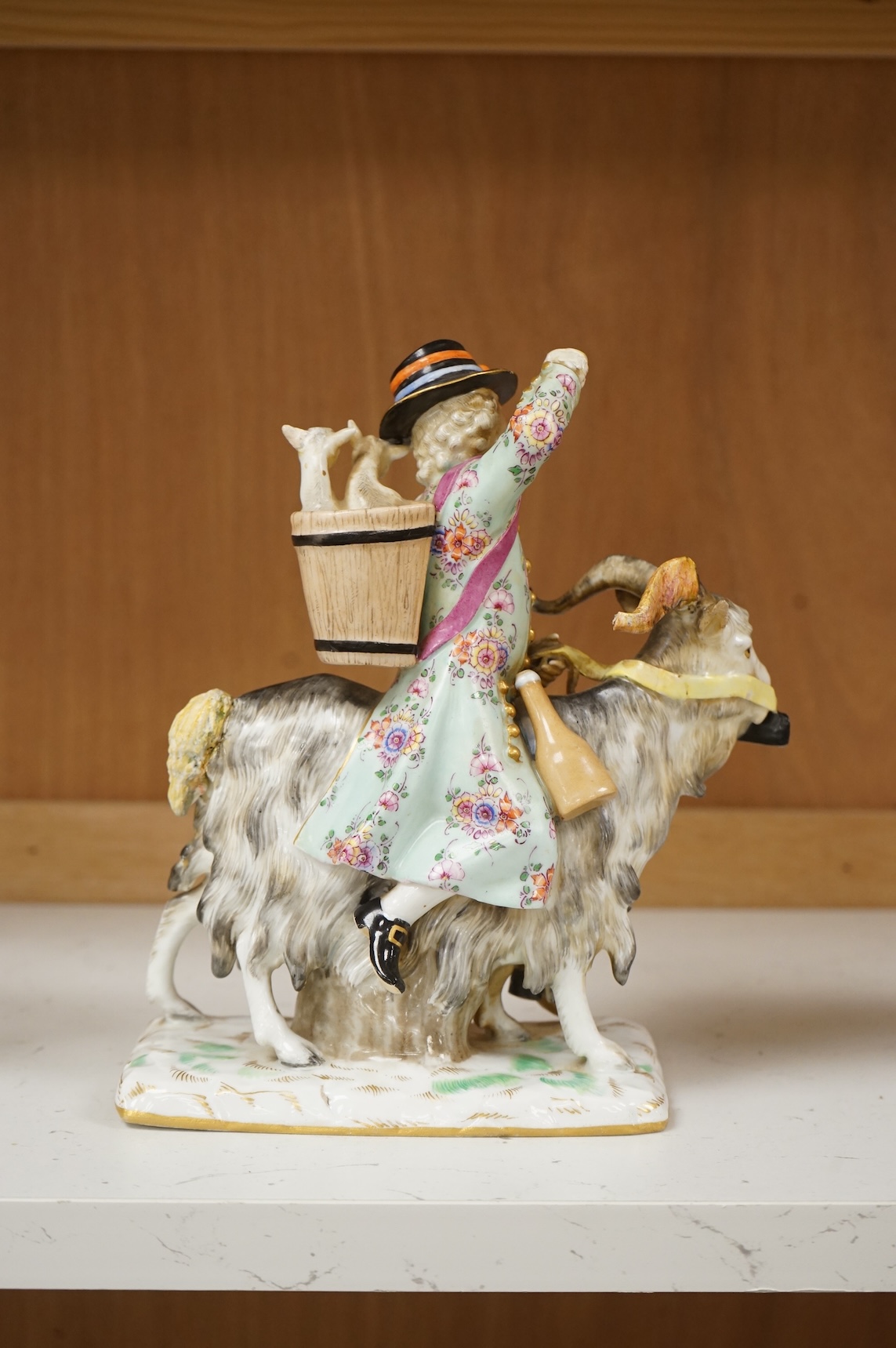 A 19th century German porcelain group of Count Von Bruhl's Tailor, 19cm wide